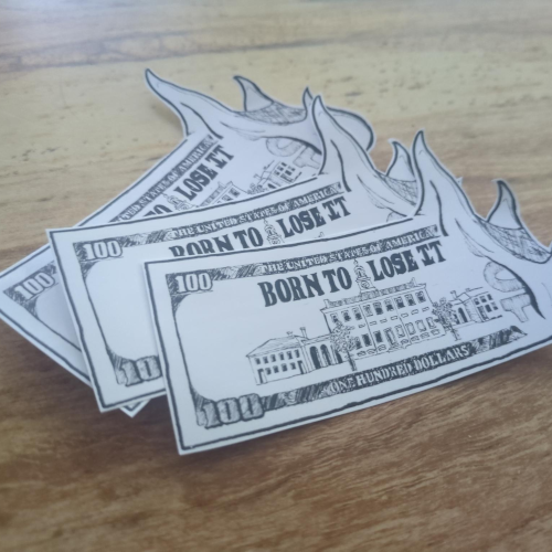 A burning hundred dollar bill with 'Born to Lose It' instead of 'In God we Trust'